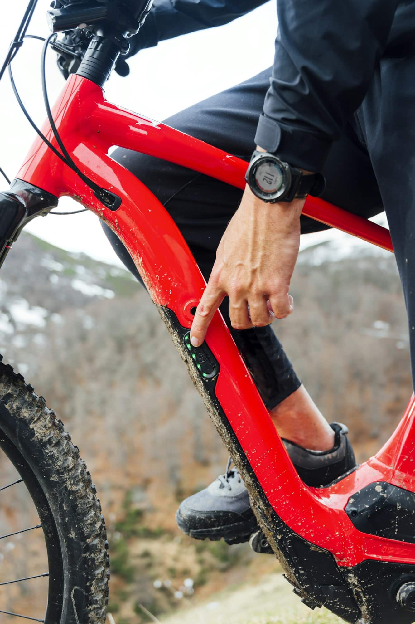 Man connecting an electric mountain bike